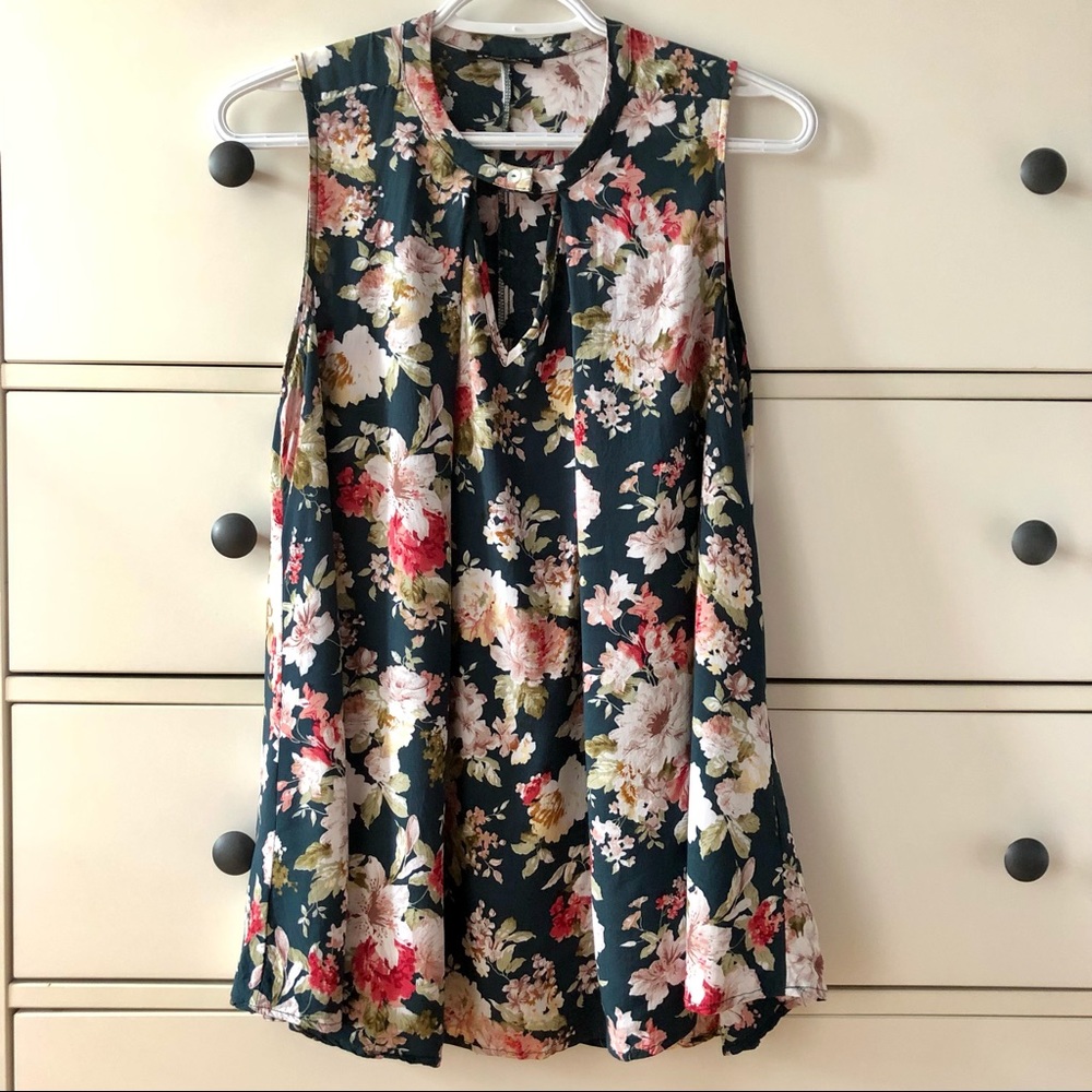 Sleeveless green and flowered blouse